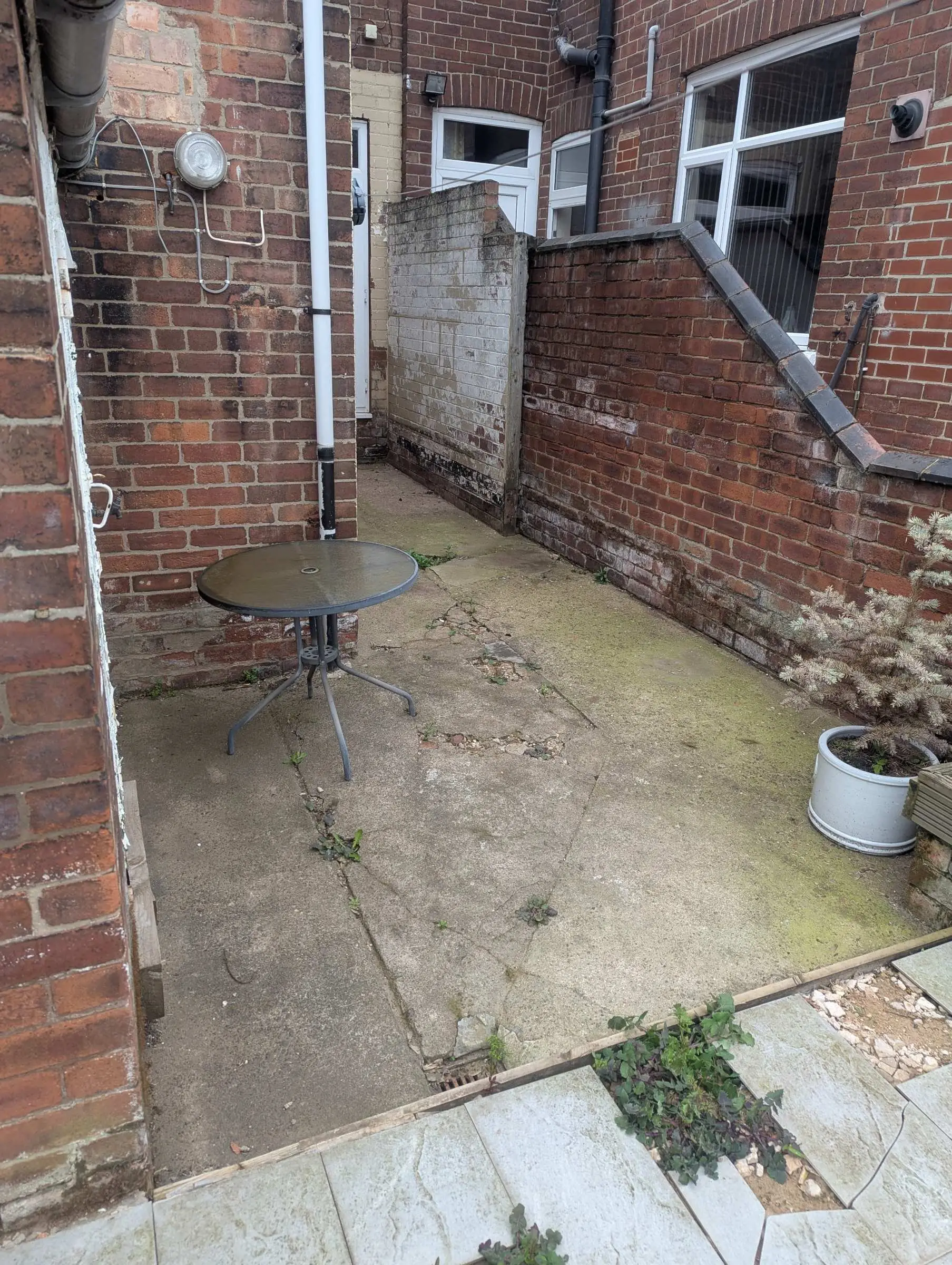 Concrete path leading to the side passage