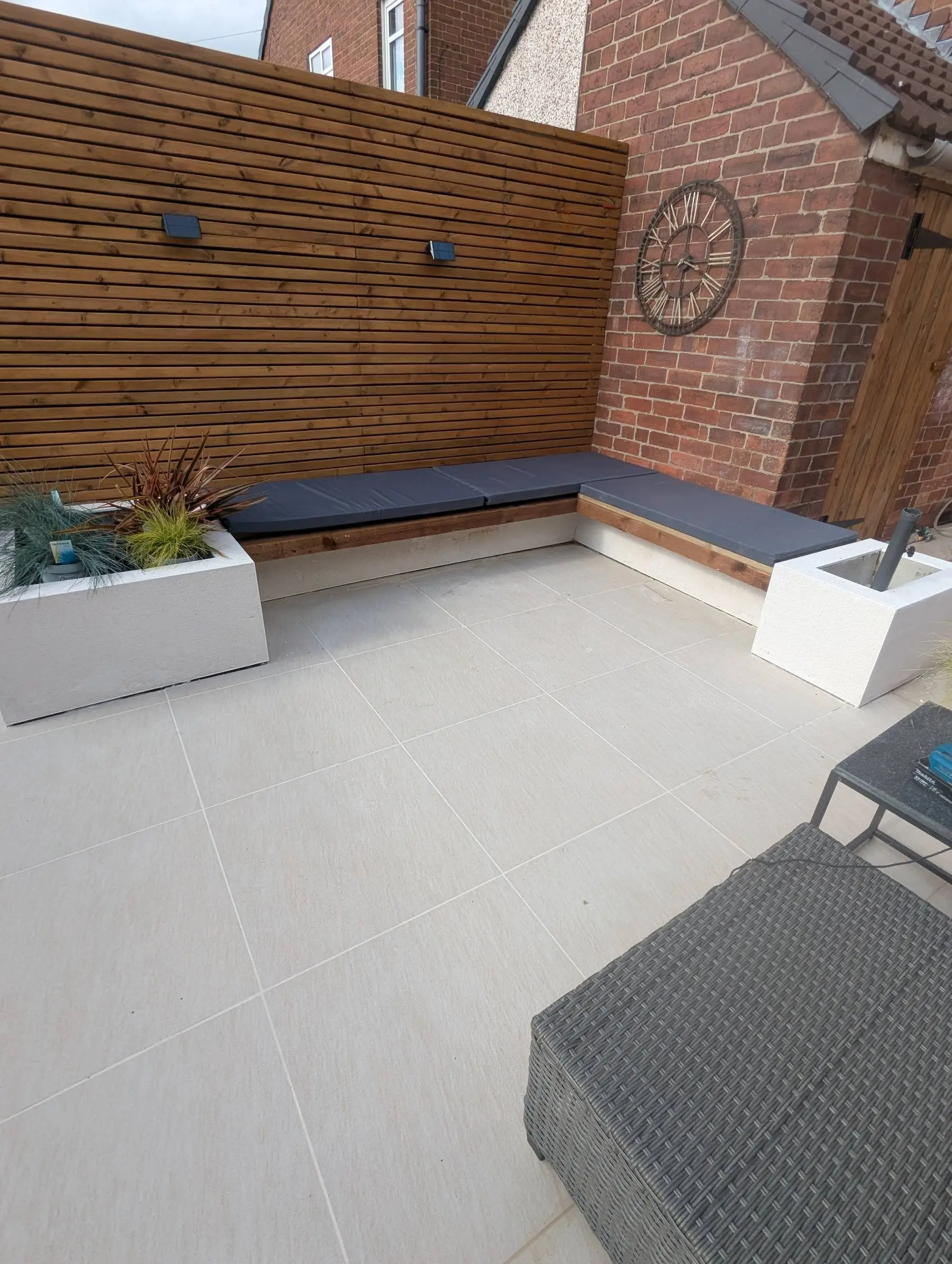 Low maintenance patio with new planting