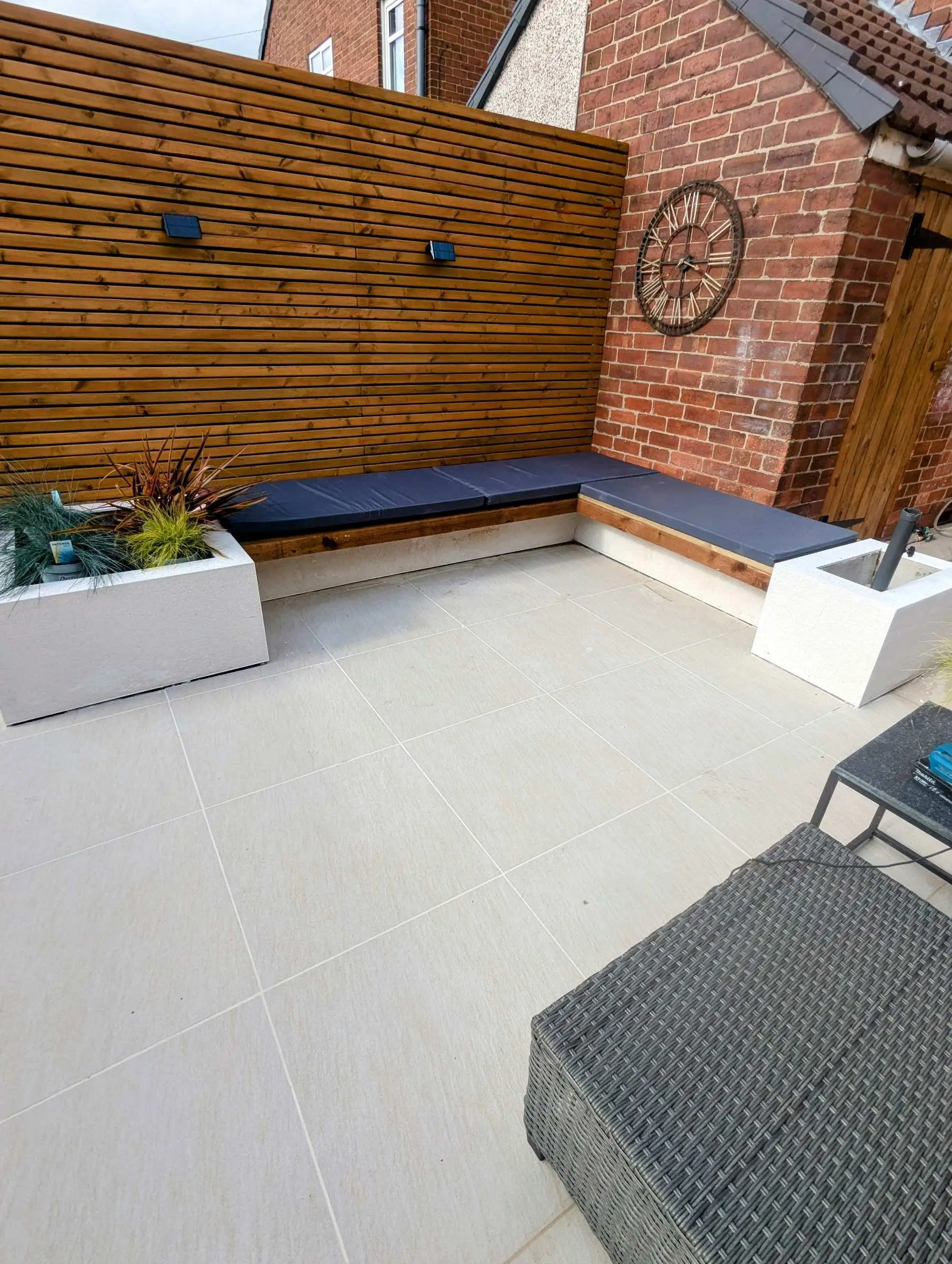 Built-in seating and planters with cushions