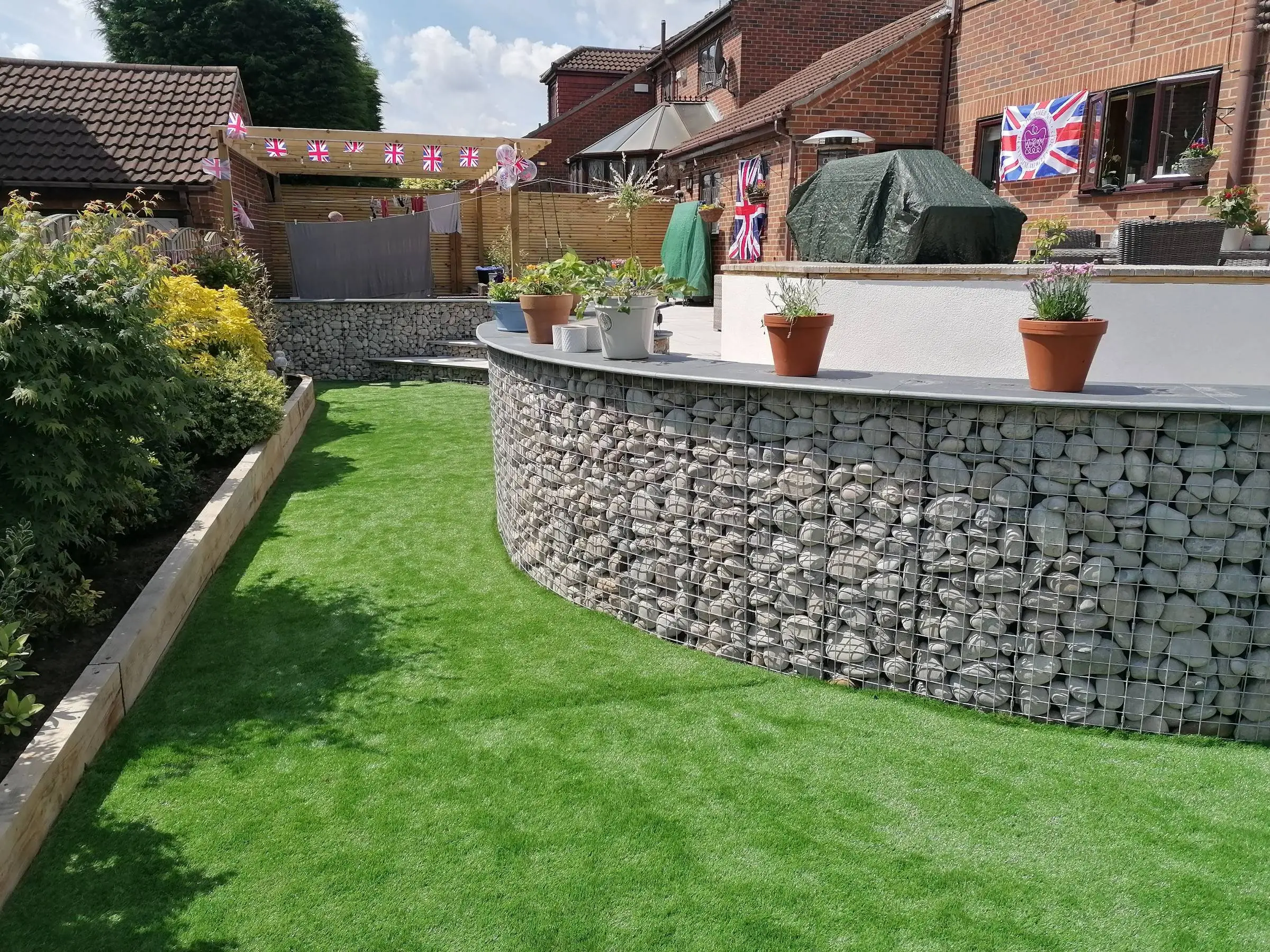 Cantley garden redesigned with gabion walls and large patio
