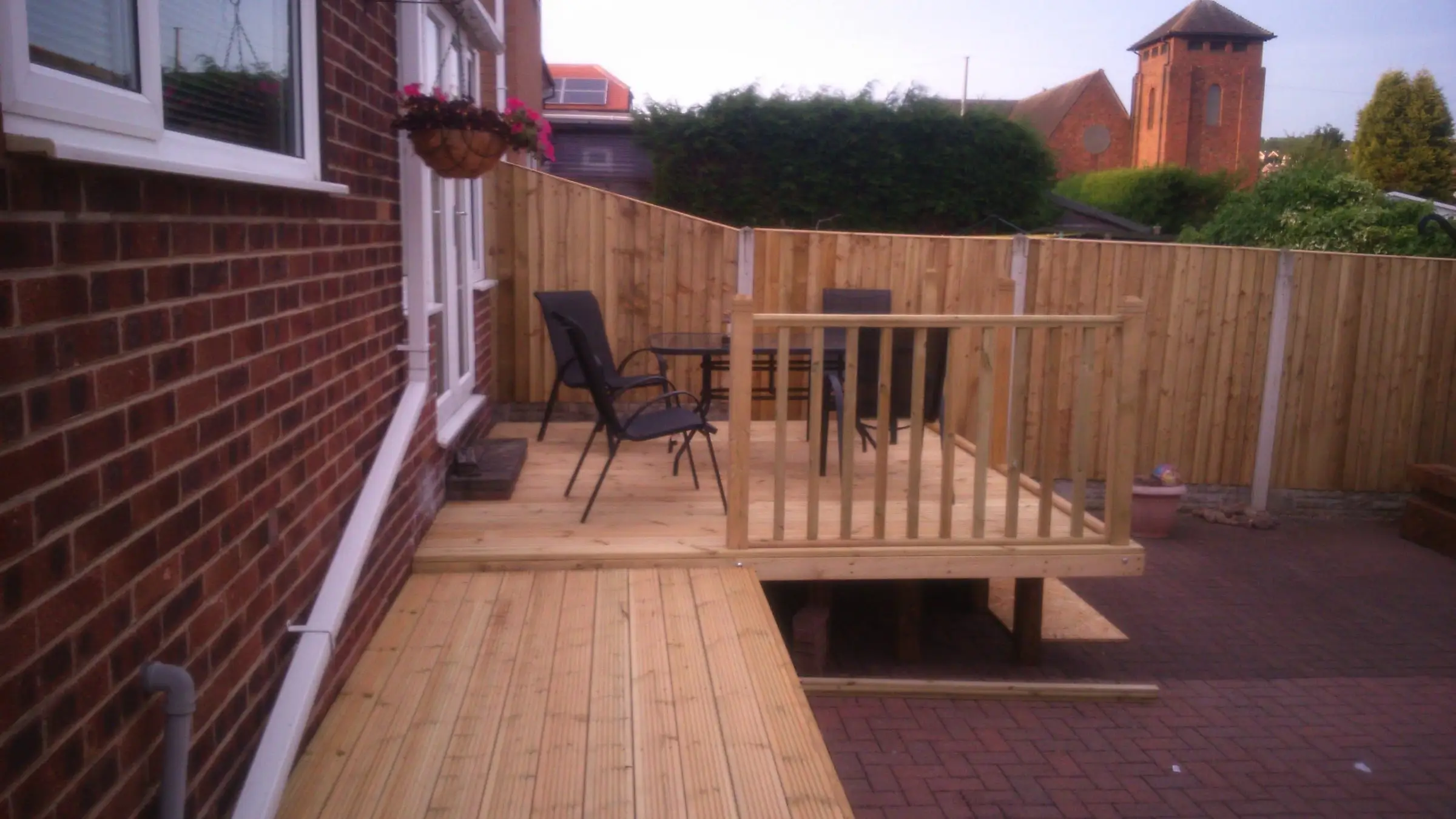 Decking with gabion detail, lawn reinstated and raised sleeper planters