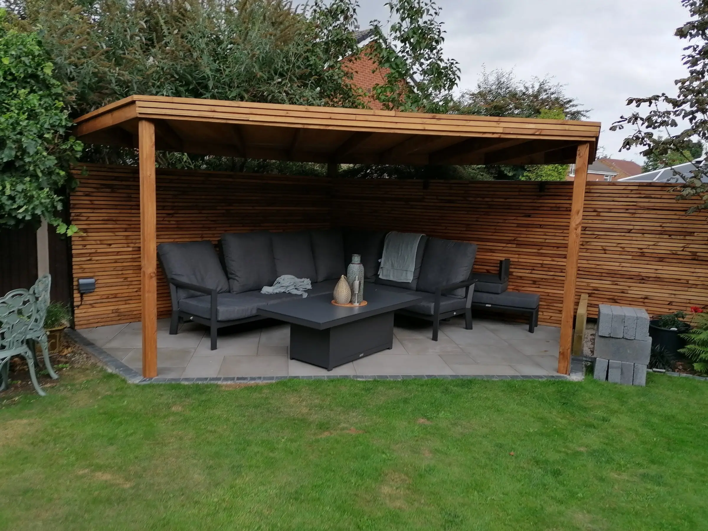 Garden redesign with bespoke timber structures and paving