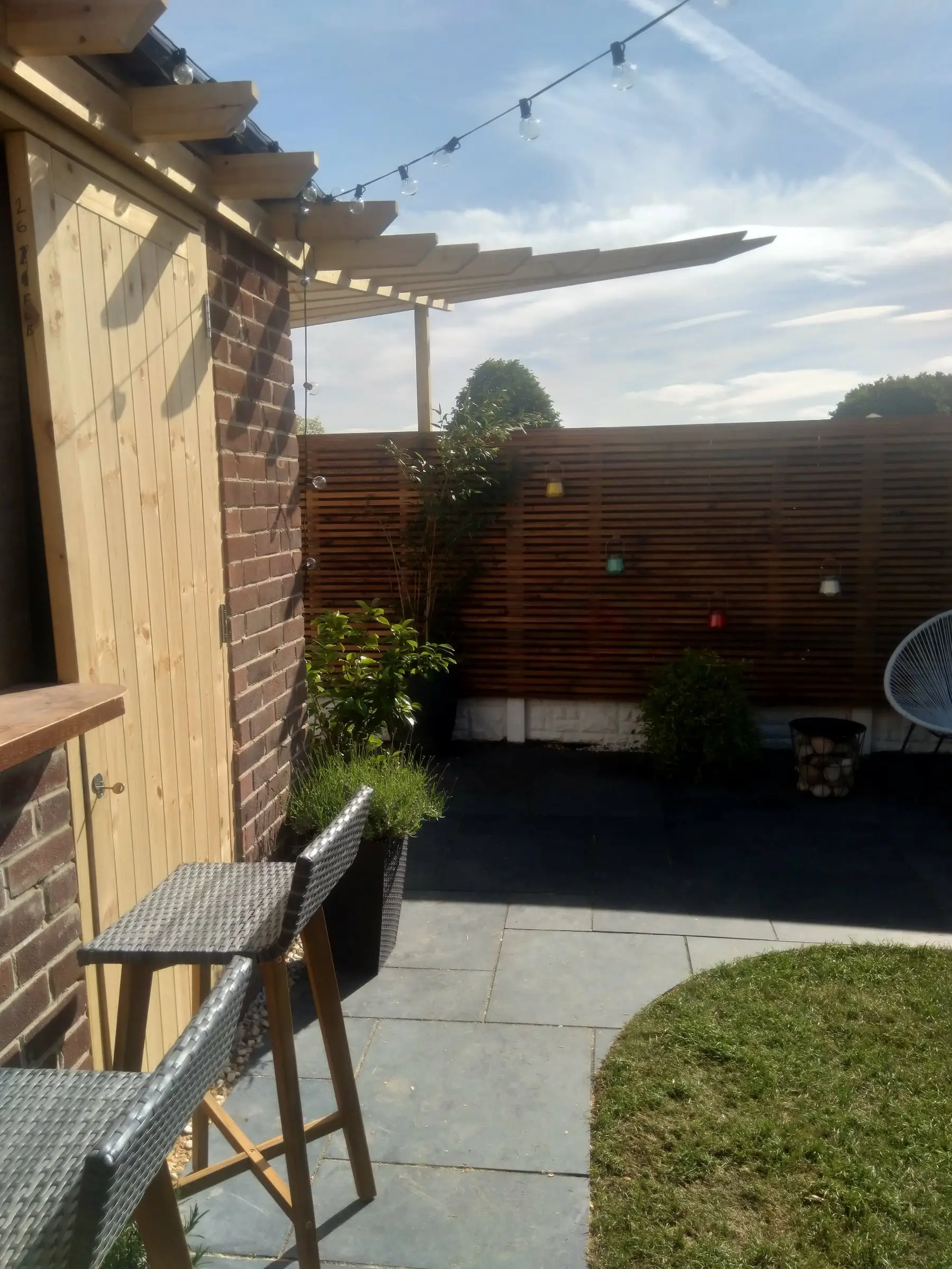 Scawsby small garden with gabion steps and water feature