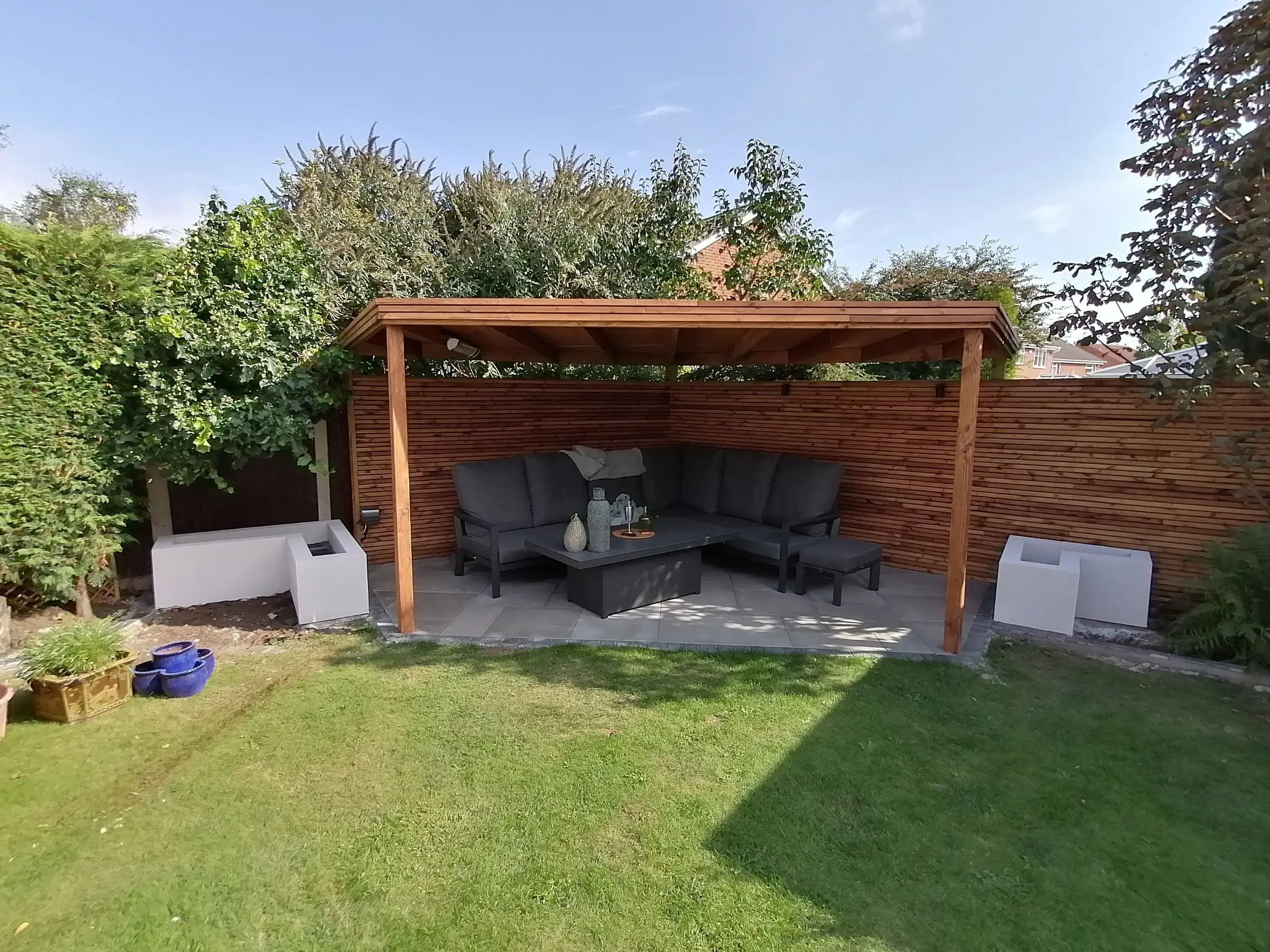 Garden redesign with bespoke timber structures and paving