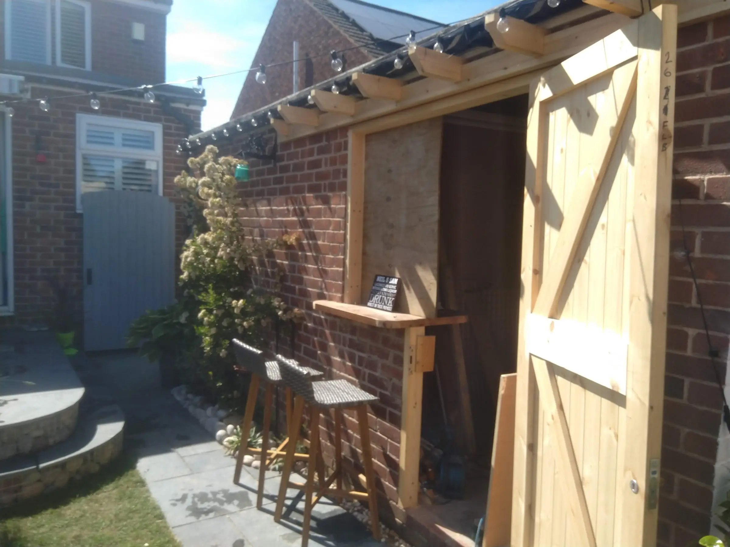 Scawsby small garden with gabion steps and water feature