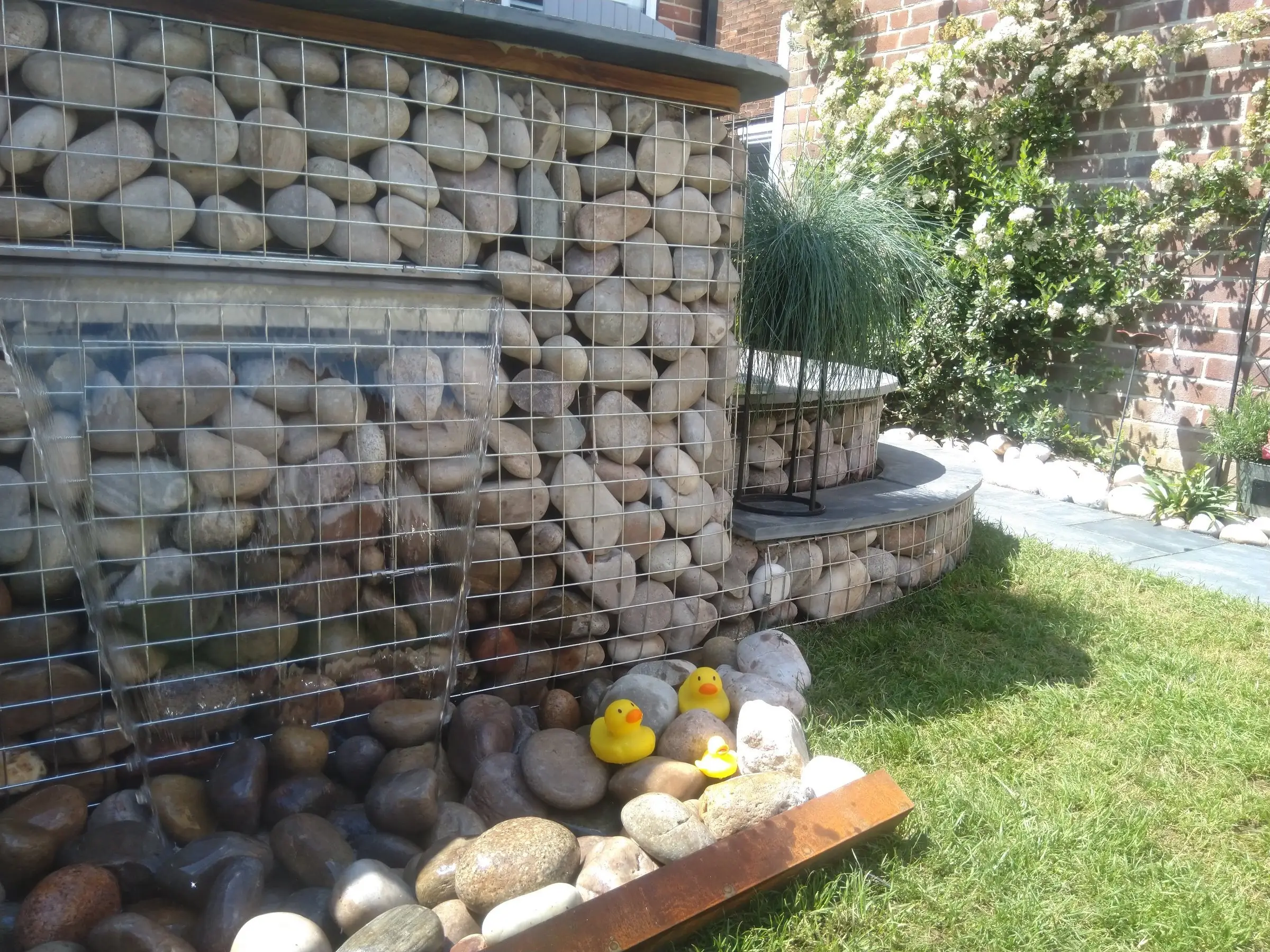 Scawsby small garden with gabion steps and water feature