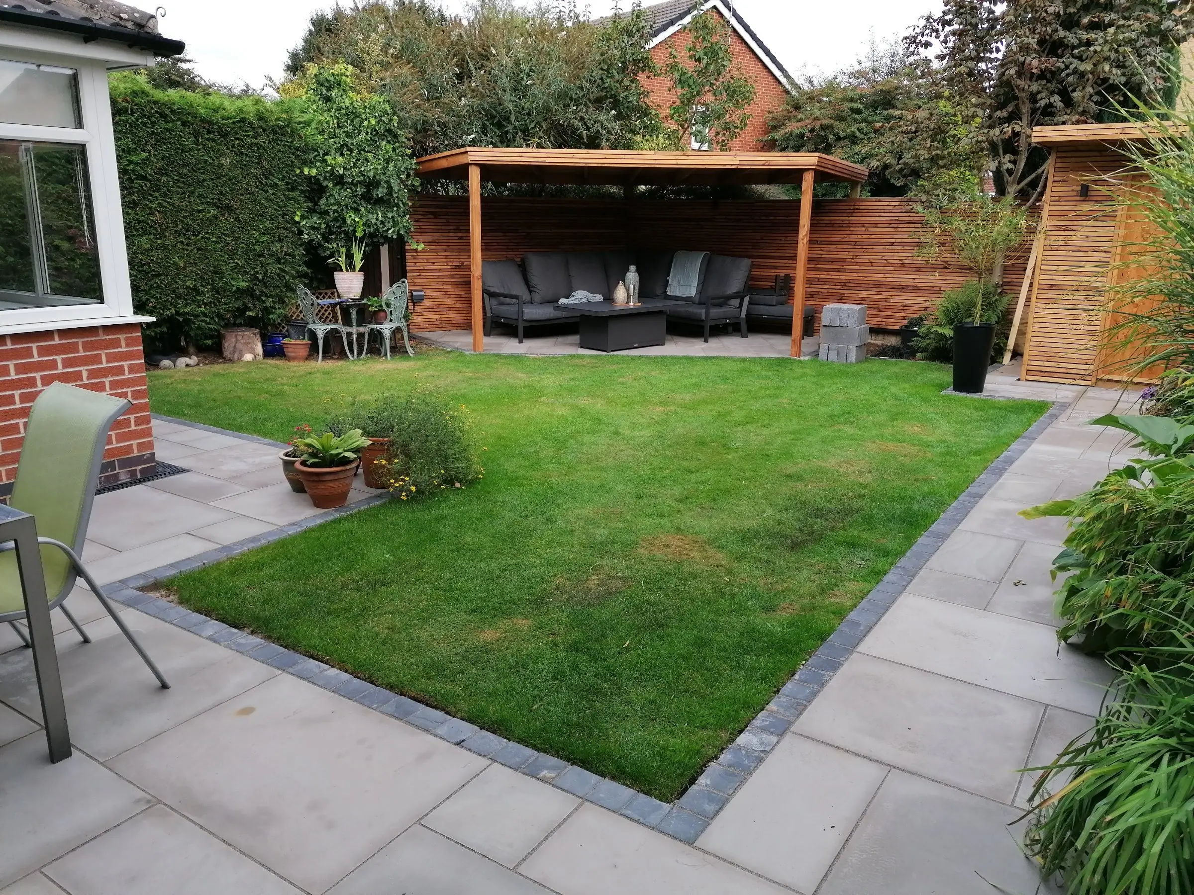 Garden redesign with bespoke timber structures and paving