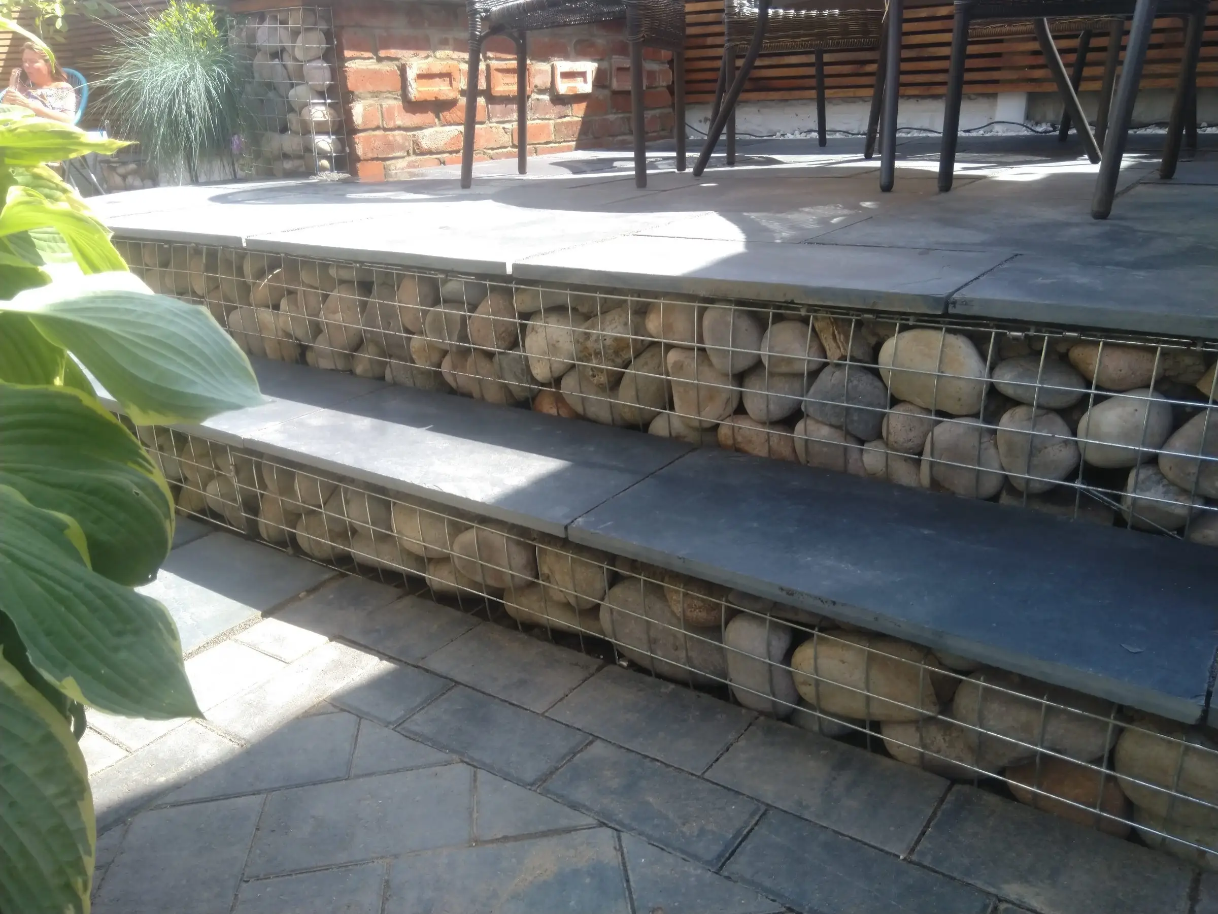 Scawsby small garden with gabion steps and water feature