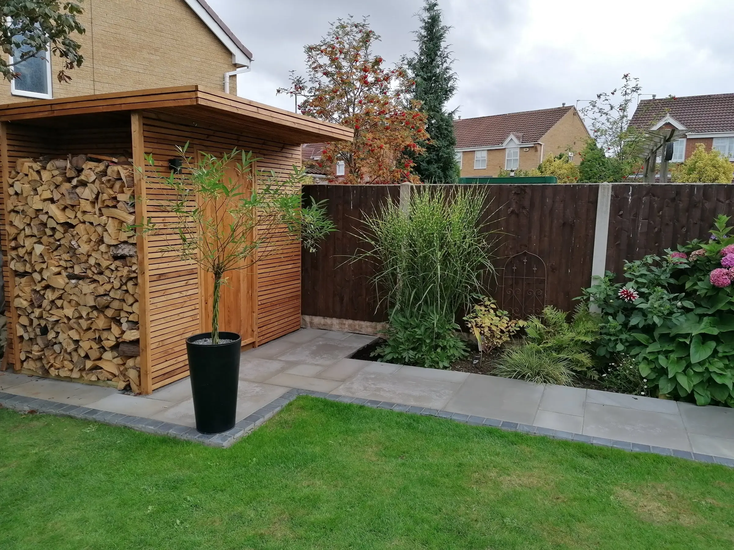 Garden redesign with bespoke timber structures and paving