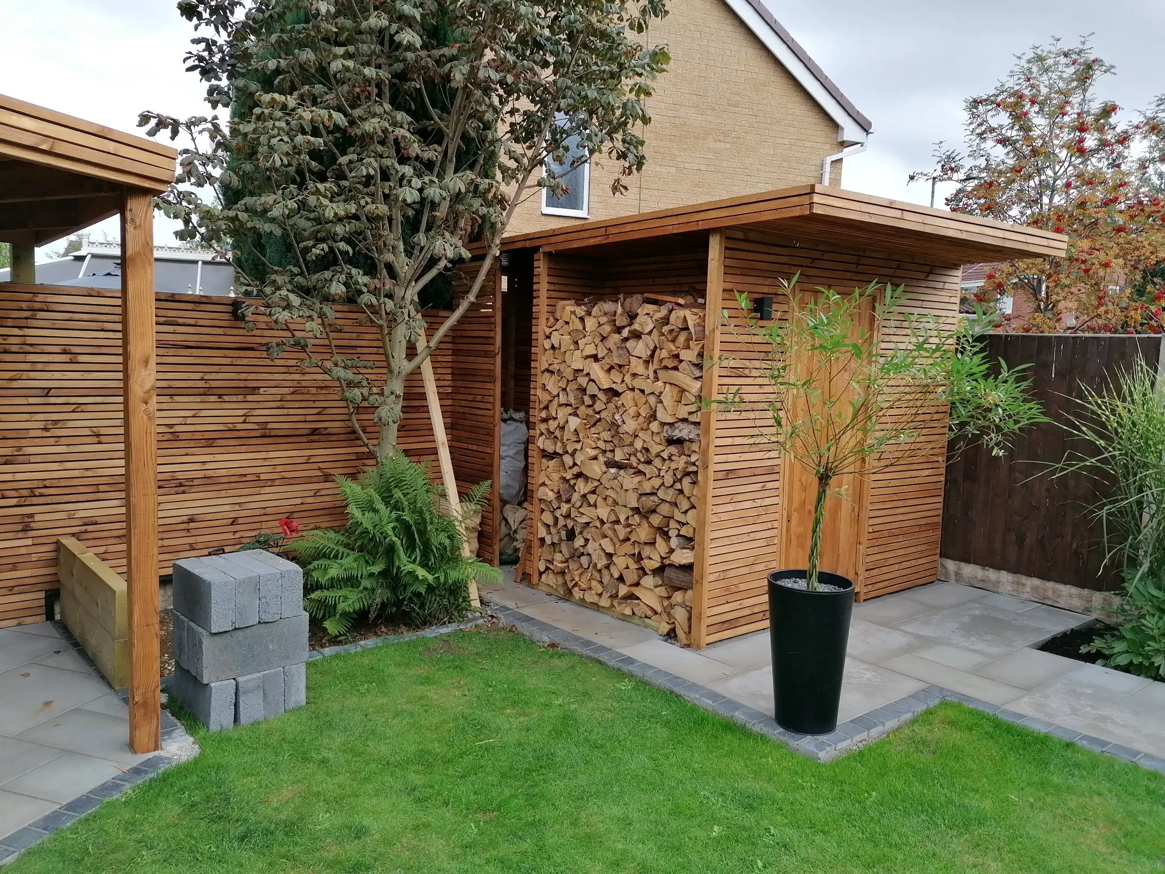 Garden redesign with bespoke timber structures and paving